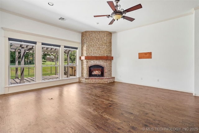 7816 E Galveston St, Broken Arrow, OK 74014 - unfurnished living room with crown molding, ceiling fan, wood finished floors, and a fireplace