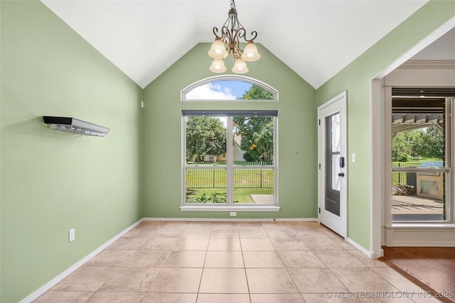 7816 E Galveston St, Broken Arrow, OK 74014 - spare room featuring a chandelier, plenty of natural light, vaulted ceiling, and tile patterned floors