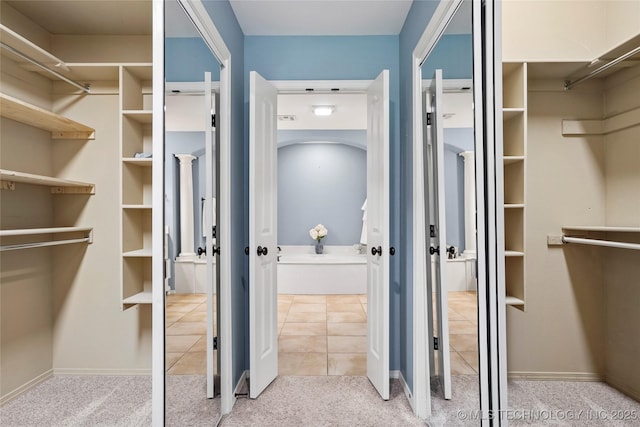 7816 E Galveston St, Broken Arrow, OK 74014 - walk in closet featuring carpet flooring and tile patterned floors