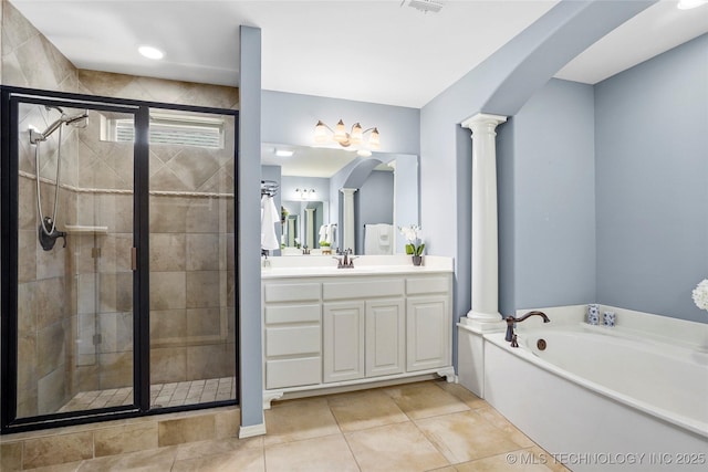 7816 E Galveston St, Broken Arrow, OK 74014 - full bathroom with decorative columns, a shower stall, vanity, a bath, and tile patterned floors