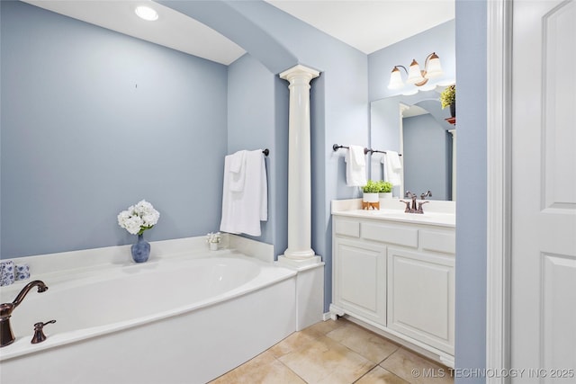 7816 E Galveston St, Broken Arrow, OK 74014 - full bath featuring ornate columns, vanity, a garden tub, and tile patterned flooring