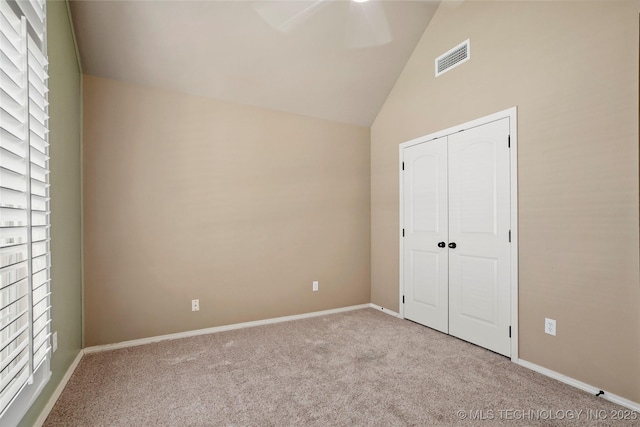 7816 E Galveston St, Broken Arrow, OK 74014 - unfurnished bedroom featuring carpet floors, a closet, high vaulted ceiling, and a ceiling fan