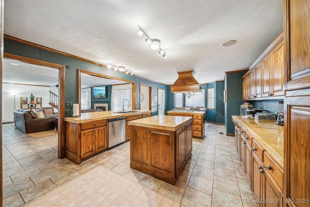 4704 W 88th St, Tulsa, OK 74132 - kitchen with stainless steel dishwasher, a kitchen island, brown cabinets, ornamental molding, and a peninsula