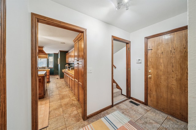 4704 W 88th St, Tulsa, OK 74132 - corridor with baseboards and stairs