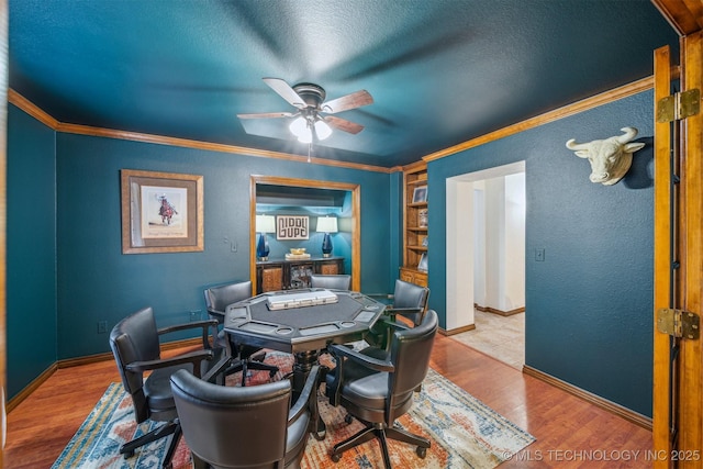 4704 W 88th St, Tulsa, OK 74132 - office area featuring ceiling fan, wood finished floors, crown molding, a textured ceiling, and built in shelves