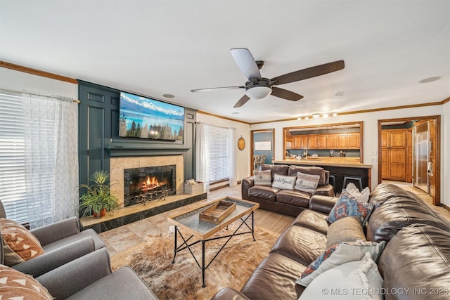 4704 W 88th St, Tulsa, OK 74132 - living area with crown molding, a high end fireplace, and a ceiling fan