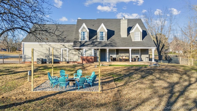 4704 W 88th St, Tulsa, OK 74132 - back of house featuring a fire pit, a chimney, roof with shingles, a patio, and board and batten siding