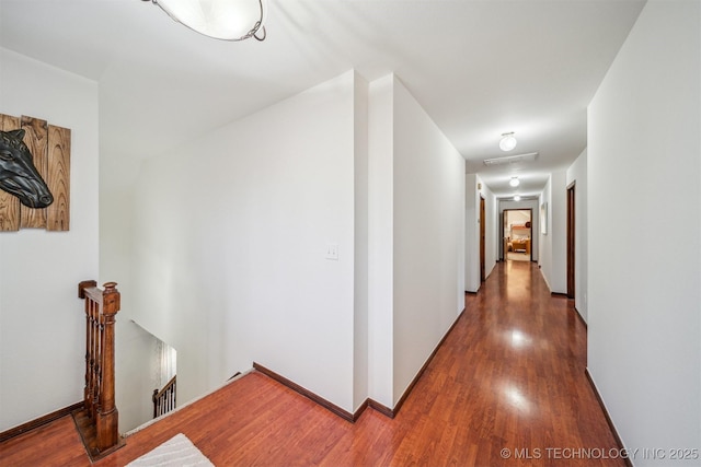 4704 W 88th St, Tulsa, OK 74132 - hallway with an upstairs landing and wood finished floors