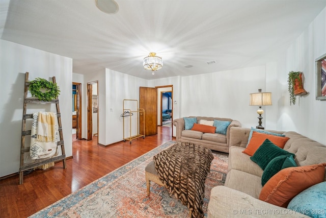 4704 W 88th St, Tulsa, OK 74132 - living area featuring wood finished floors and a chandelier