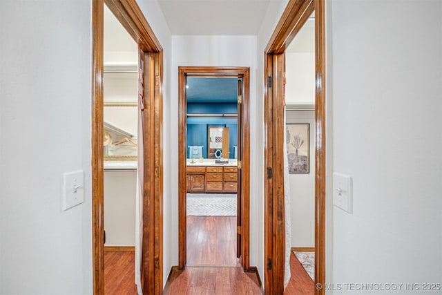 4704 W 88th St, Tulsa, OK 74132 - hall with wood finished floors and baseboards