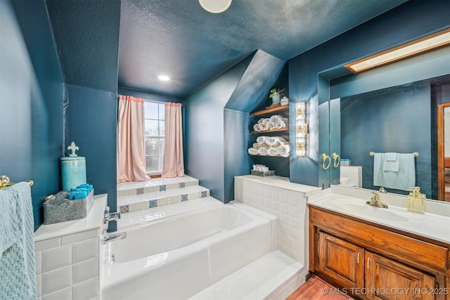 4704 W 88th St, Tulsa, OK 74132 - full bath featuring a bath, vanity, and a textured ceiling