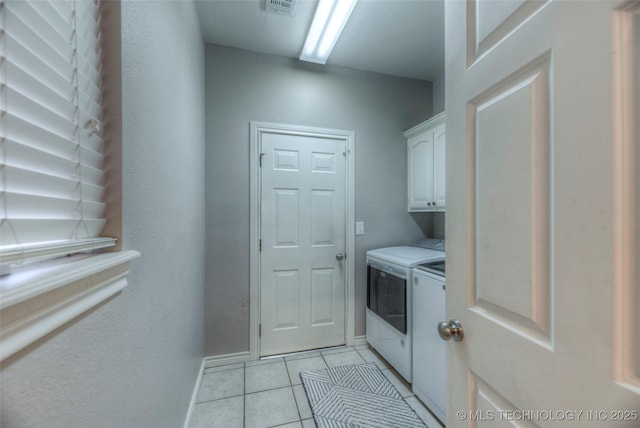 8414 E 99th Pl, Tulsa, OK 74133 - washroom with washing machine and clothes dryer, cabinet space, and light tile patterned floors