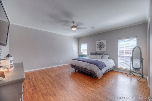 8414 E 99th Pl, Tulsa, OK 74133 - bedroom with crown molding, light wood-style flooring, and a ceiling fan