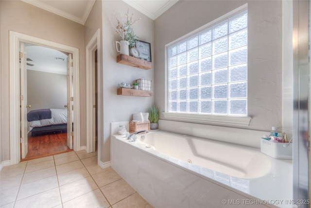 8414 E 99th Pl, Tulsa, OK 74133 - ensuite bathroom with crown molding, a bath, and tile patterned floors