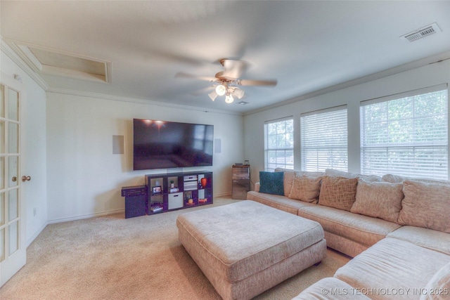 8414 E 99th Pl, Tulsa, OK 74133 - carpeted living room featuring a ceiling fan, ornamental molding, and attic access