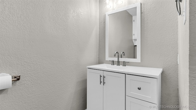 1412 Healdton Blvd, Ardmore, OK 73401 - bathroom featuring vanity and a textured wall
