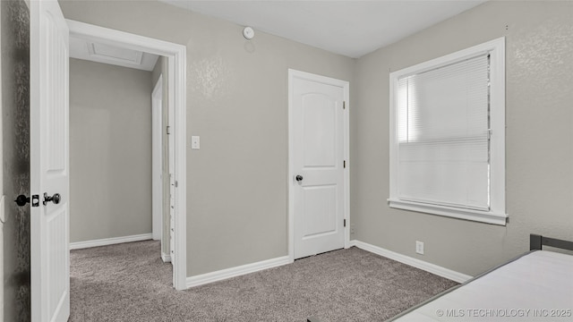 1412 Healdton Blvd, Ardmore, OK 73401 - unfurnished bedroom featuring carpet floors and attic access