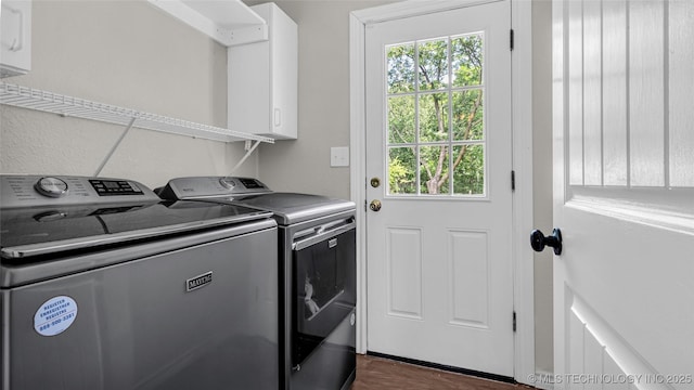 1412 Healdton Blvd, Ardmore, OK 73401 - washroom with washer and dryer, plenty of natural light, dark wood finished floors, and cabinet space