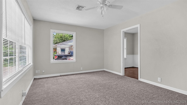 1412 Healdton Blvd, Ardmore, OK 73401 - carpeted empty room featuring a ceiling fan and baseboards