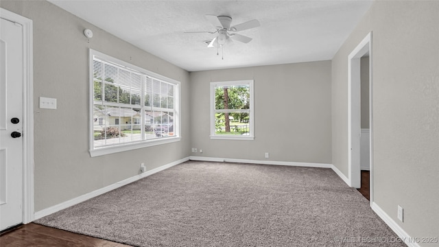 1412 Healdton Blvd, Ardmore, OK 73401 - unfurnished room with ceiling fan, a textured ceiling, and dark carpet