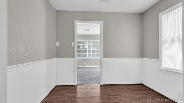 1412 Healdton Blvd, Ardmore, OK 73401 - empty room with wood finished floors and wainscoting