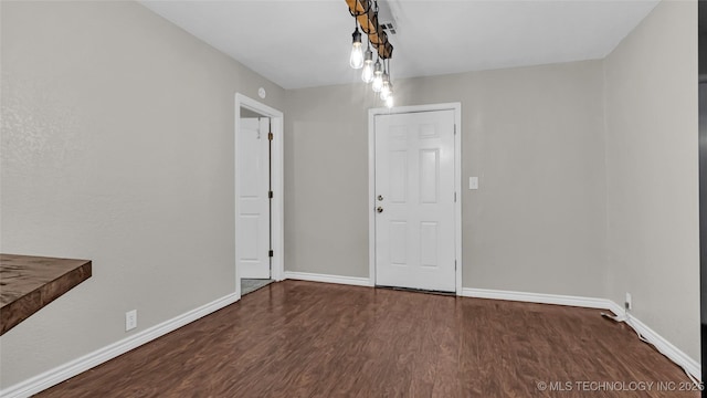 1412 Healdton Blvd, Ardmore, OK 73401 - unfurnished dining area featuring wood finished floors and baseboards