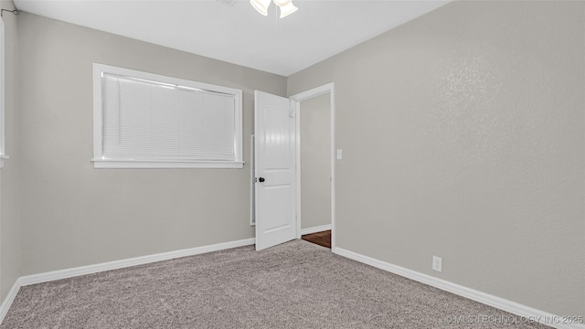 1412 Healdton Blvd, Ardmore, OK 73401 - spare room featuring carpet and ceiling fan