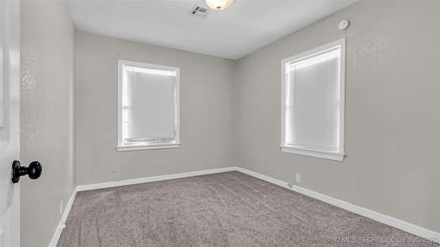 1412 Healdton Blvd, Ardmore, OK 73401 - empty room featuring carpet floors and a smoke detector