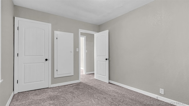 1412 Healdton Blvd, Ardmore, OK 73401 - unfurnished bedroom featuring carpet and baseboards