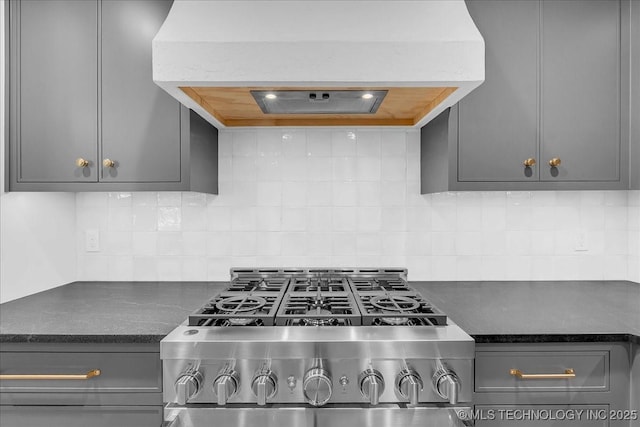 4155 S Birmingham Pl, Tulsa, OK 74105 - kitchen with stove, extractor fan, gray cabinetry, and decorative backsplash