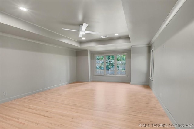 4155 S Birmingham Pl, Tulsa, OK 74105 - unfurnished room with a tray ceiling, light wood finished floors, ornamental molding, a ceiling fan, and recessed lighting