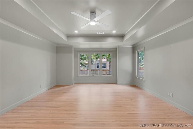 4155 S Birmingham Pl, Tulsa, OK 74105 - unfurnished room featuring a tray ceiling, ceiling fan, light wood finished floors, ornamental molding, and recessed lighting