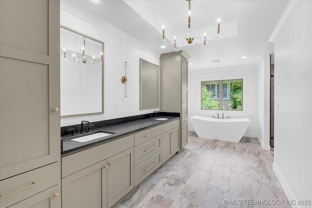 4155 S Birmingham Pl, Tulsa, OK 74105 - bathroom featuring a chandelier, a soaking tub, crown molding, double vanity, and marble finish flooring