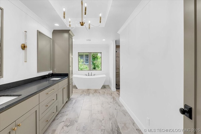 4155 S Birmingham Pl, Tulsa, OK 74105 - full bath with a soaking tub, a chandelier, double vanity, marble look tile flooring, and recessed lighting