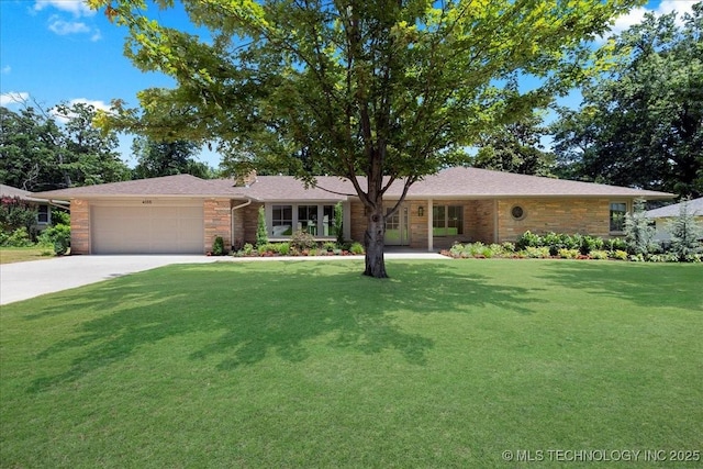 4155 S Birmingham Pl, Tulsa, OK 74105 - ranch-style home with a front yard, an attached garage, driveway, and brick siding