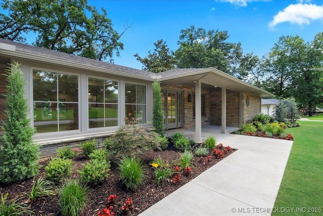 4155 S Birmingham Pl, Tulsa, OK 74105 - view of side of home featuring covered porch and a lawn