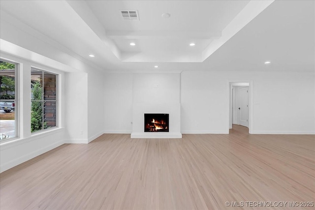 4155 S Birmingham Pl, Tulsa, OK 74105 - unfurnished living room with a raised ceiling, a lit fireplace, light wood finished floors, and recessed lighting