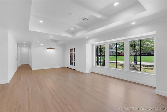 4155 S Birmingham Pl, Tulsa, OK 74105 - unfurnished living room with a raised ceiling, light wood-type flooring, and recessed lighting