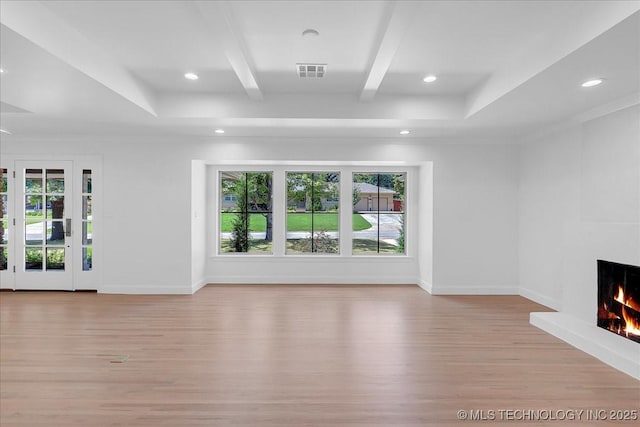 4155 S Birmingham Pl, Tulsa, OK 74105 - unfurnished living room featuring light wood-style floors, plenty of natural light, a large fireplace, beamed ceiling, and recessed lighting