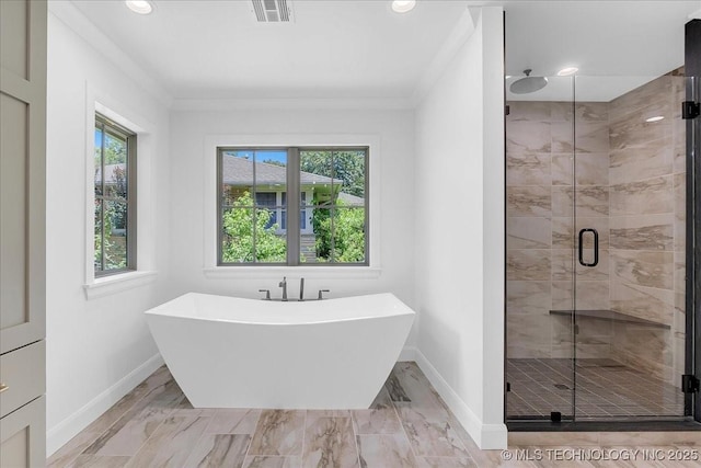 4155 S Birmingham Pl, Tulsa, OK 74105 - bathroom featuring healthy amount of natural light, a soaking tub, a stall shower, marble look tiles, and recessed lighting