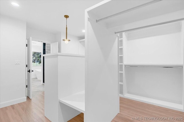 4155 S Birmingham Pl, Tulsa, OK 74105 - spacious closet featuring wood finished floors