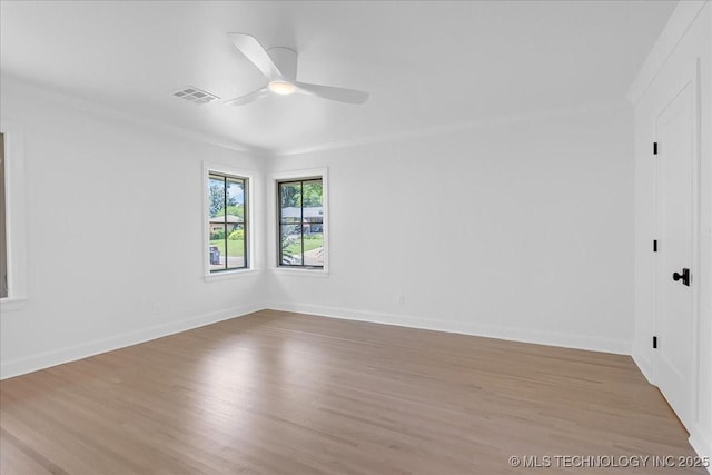 4155 S Birmingham Pl, Tulsa, OK 74105 - spare room featuring ornamental molding, wood finished floors, and ceiling fan