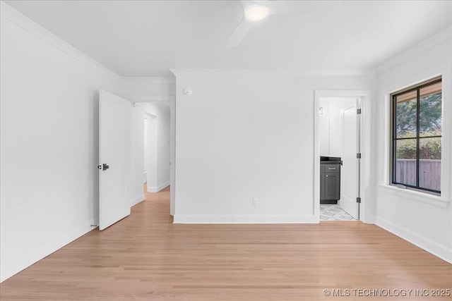 4155 S Birmingham Pl, Tulsa, OK 74105 - spare room featuring ornamental molding, light wood finished floors, and a ceiling fan