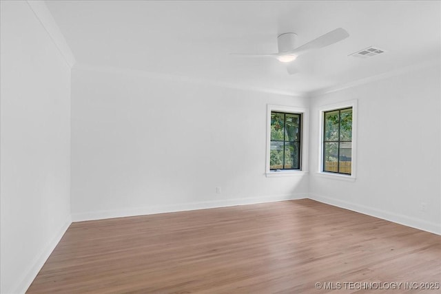 4155 S Birmingham Pl, Tulsa, OK 74105 - unfurnished room with crown molding, wood finished floors, and a ceiling fan