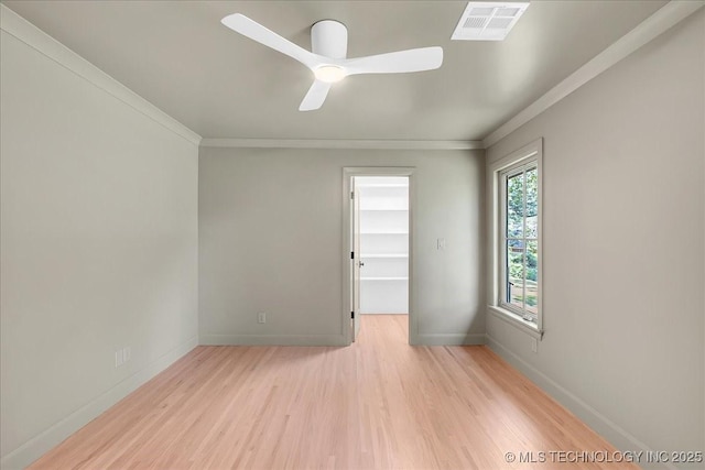 4155 S Birmingham Pl, Tulsa, OK 74105 - spare room featuring light wood finished floors, ornamental molding, and ceiling fan