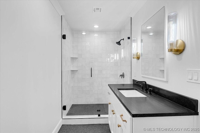 4155 S Birmingham Pl, Tulsa, OK 74105 - full bathroom with vanity, a shower stall, and recessed lighting