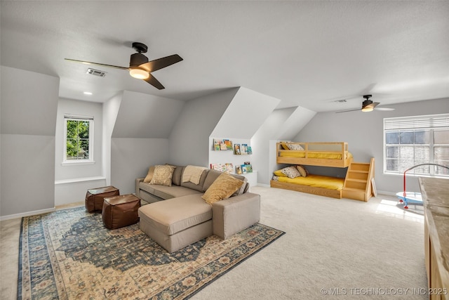 5414 E 109th Pl, Tulsa, OK 74137 - living room featuring a ceiling fan, vaulted ceiling, and carpet