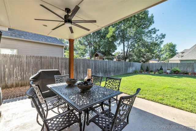 5414 E 109th Pl, Tulsa, OK 74137 - fenced backyard featuring outdoor dining area, a patio, and ceiling fan