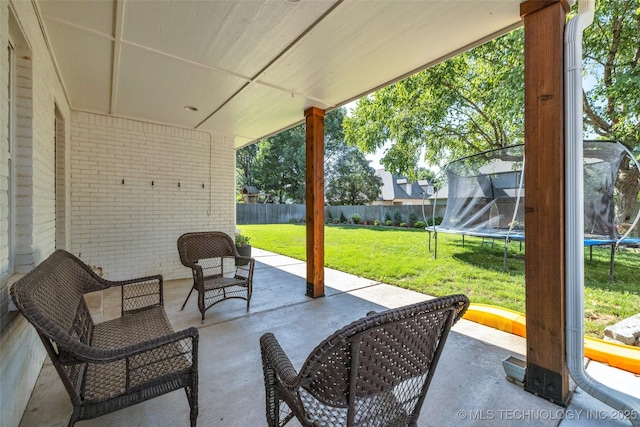 5414 E 109th Pl, Tulsa, OK 74137 - fenced backyard with a trampoline and a patio area