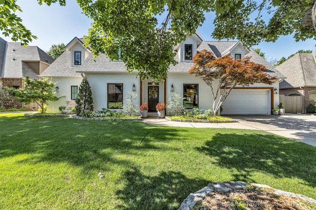 5414 E 109th Pl, Tulsa, OK 74137 - new england style home featuring driveway, a garage, a shingled roof, and brick siding